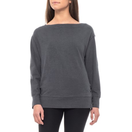 CLOSEOUTS. Search no more for that perfect weekend top, weand#39;ve got it in prAnaand#39;s Ostara shirt. Itand#39;s made from a soft hemp-and-organic-cotton-blend jersey in a relaxed fit with just enough stretch for comfort; it also features a flattering boat neck and side lacing accents at the hem. Available Colors: COAL, NAUTICAL ROSEWOOD, WINE ROSEWOOD. Sizes: XS, S, M, L, XL, 2XL.