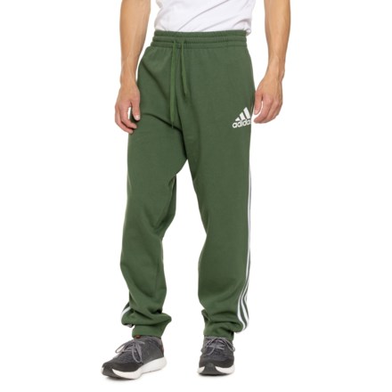 adidas Essential Fleece Joggers in Green