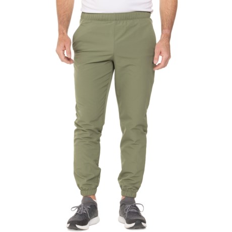 ASICS Brushed Back Woven Joggers in Olive Leaf